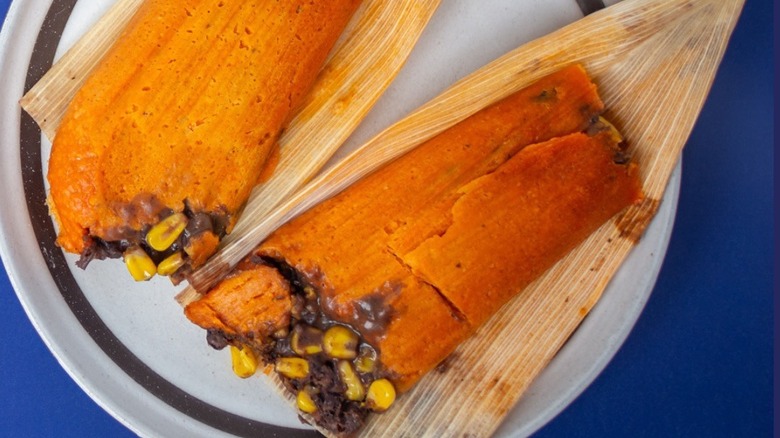 Two tamales on a plate