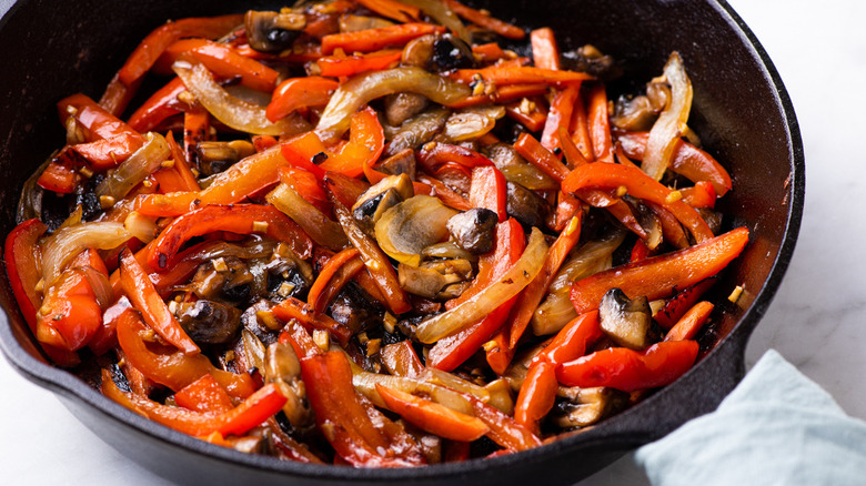 various sliced vegetables in skillet