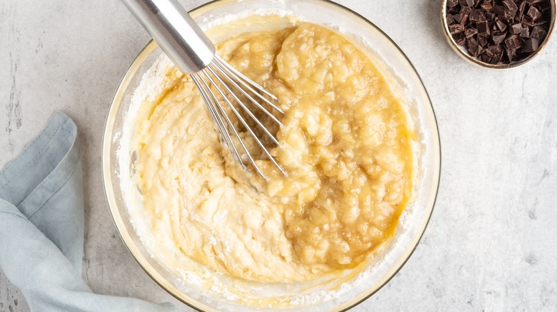 Mixing banana bread batter chocolate