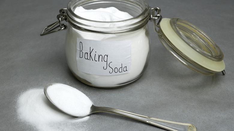 Baking soda in jar with spoon