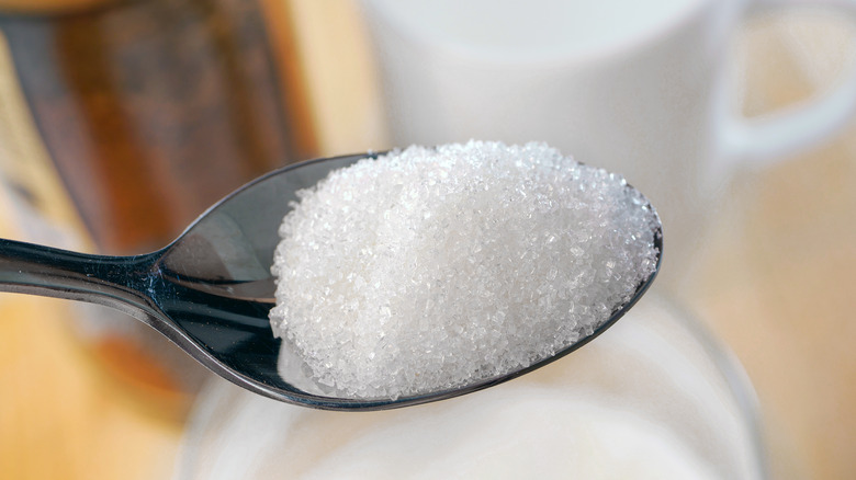 Spoonful of granulated white sugar