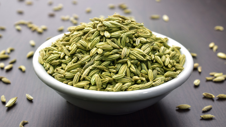 Fennel seeds in white bowl