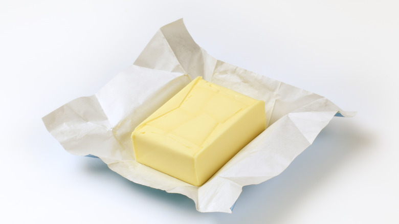 Butter in foil on surface