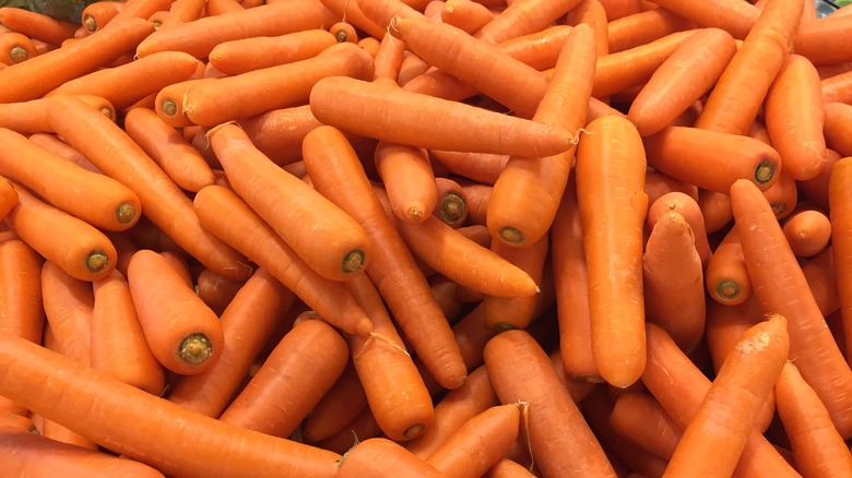 Peeled carrots background