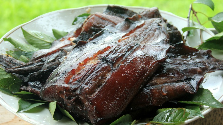 Roasted beaver tail on a plate