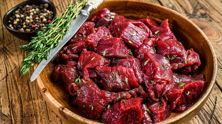 chopped raw venison meat in bowl