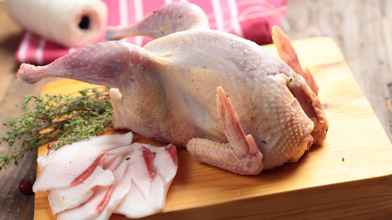 grouse on cutting board