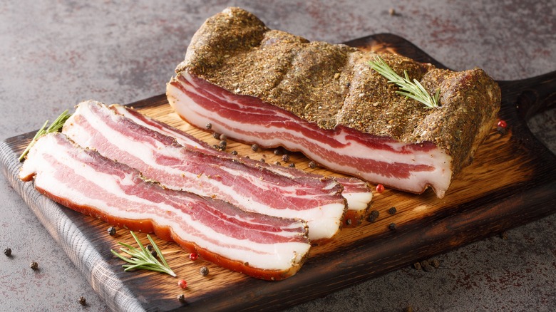 sliced pancetta on cutting board