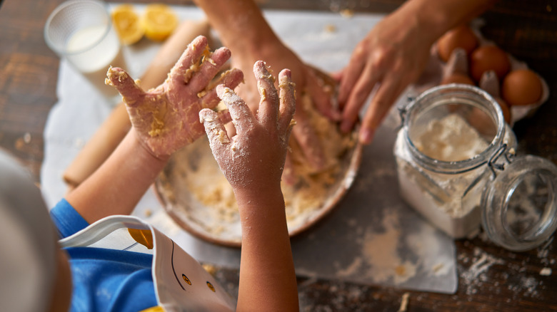 Child's hands in kitchen cookies