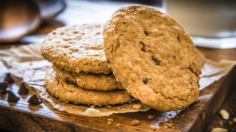 Oatmeal cookies stacked on wood