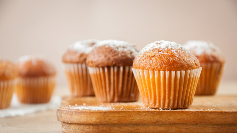 Muffins on wooden surface