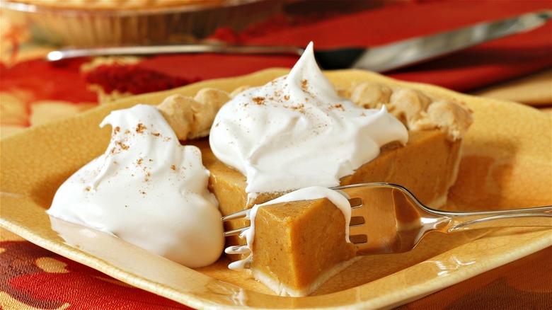 Pumpkin pie with whipped cream