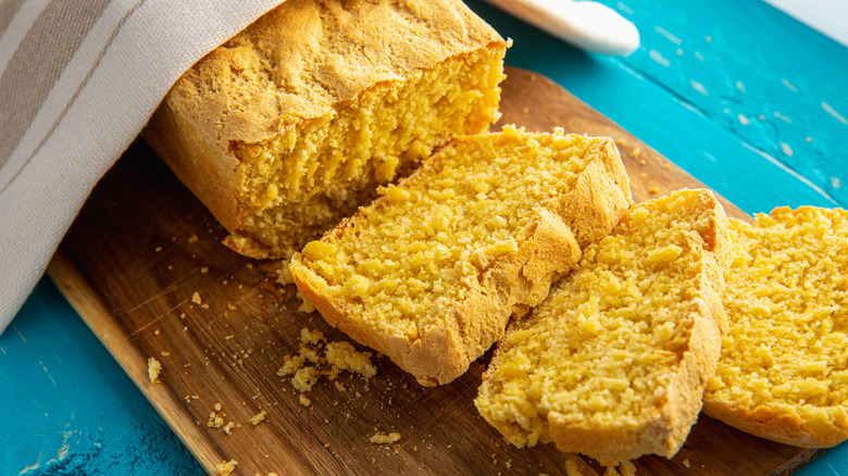 Sliced cornbread loaf on table