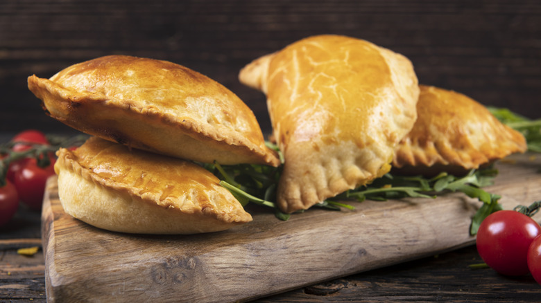 Empanadas on wooden board