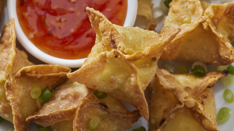 Fried wontons on plate sauce