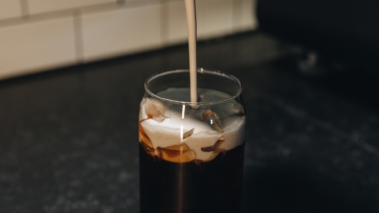 pumpkin cream poured into coffee