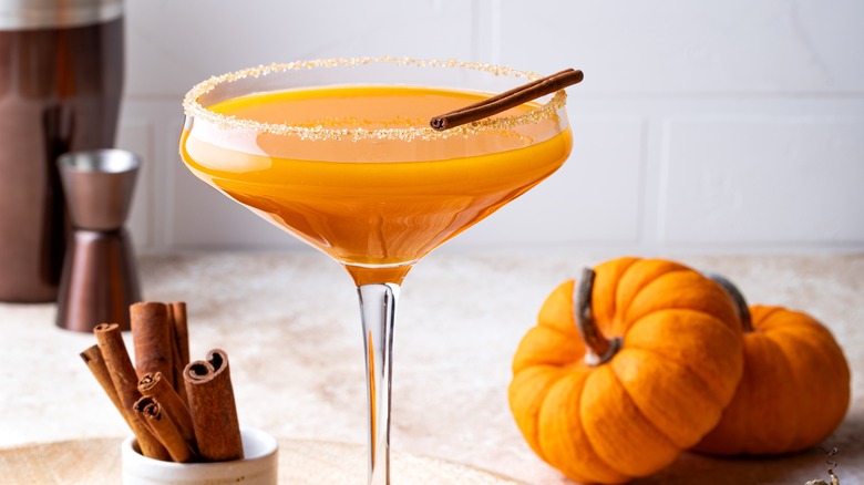 pumpkin martini with cinnamon sticks