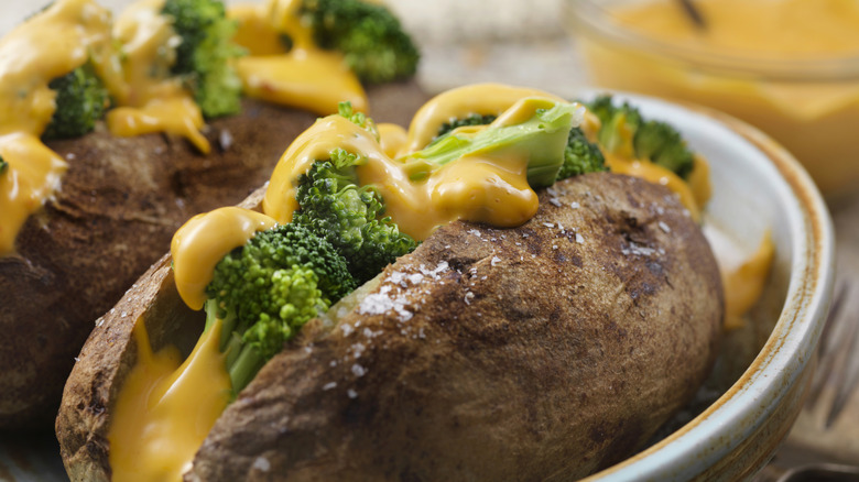 cheese sauce over broccoli and baked potatoes