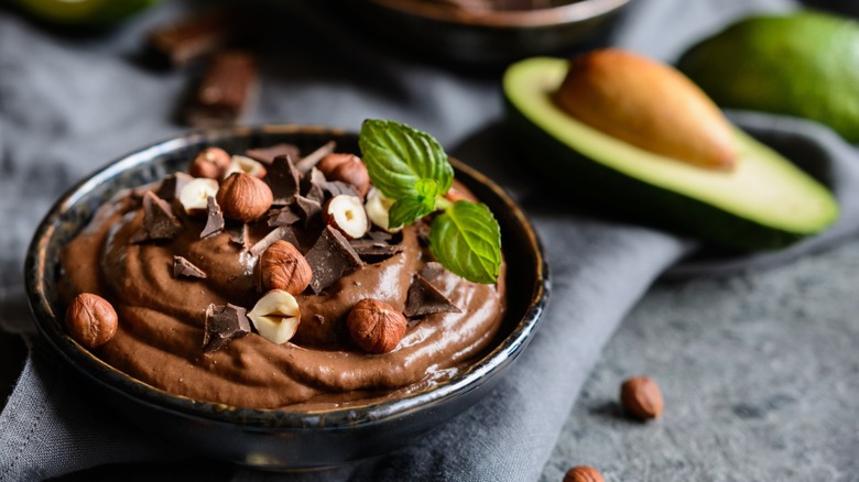 chocolate mousse with avocado in background