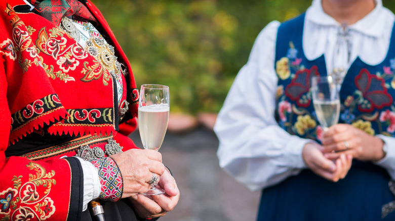 Norwegians holding wine