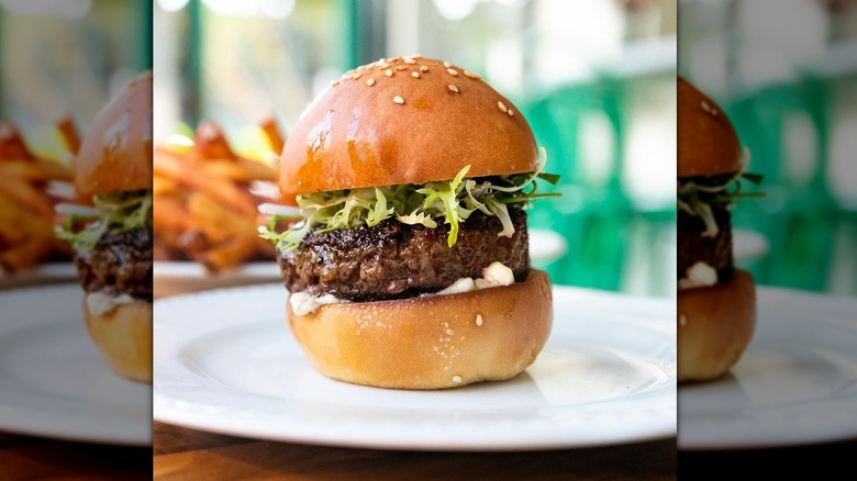 small burger with green lettuce