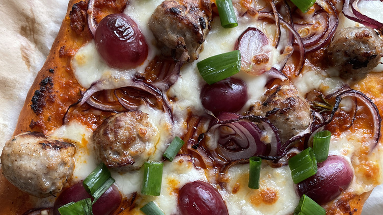 Grapes on pizza with meatballs
