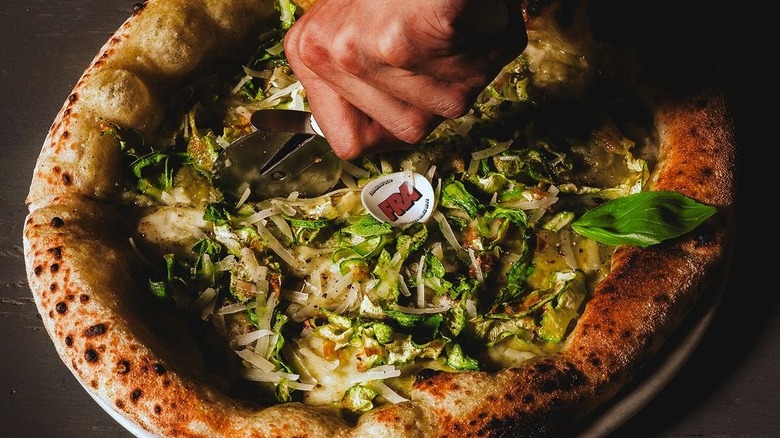 Fairy Zucchini pizza being sliced