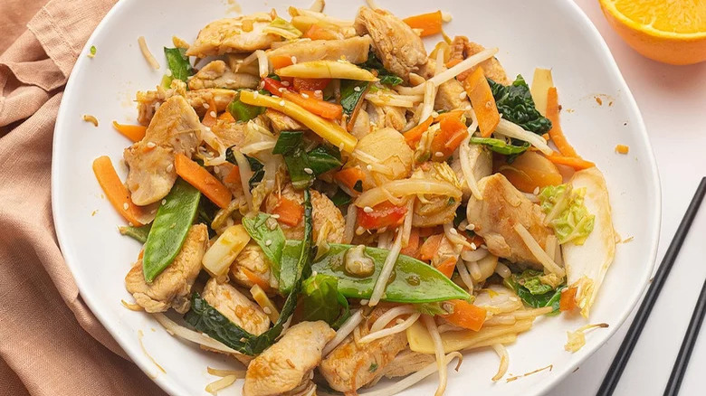 Orange stir-fry chicken in a bowl