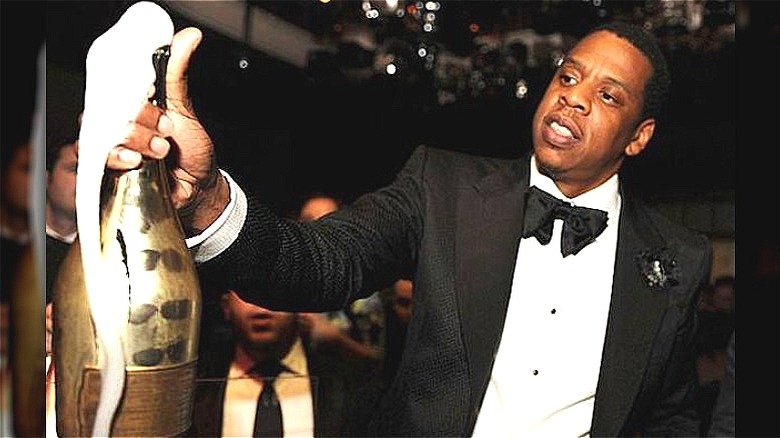 Jay Z holding champagne bottle