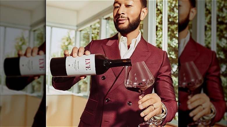 John Legend holding LVE bottle