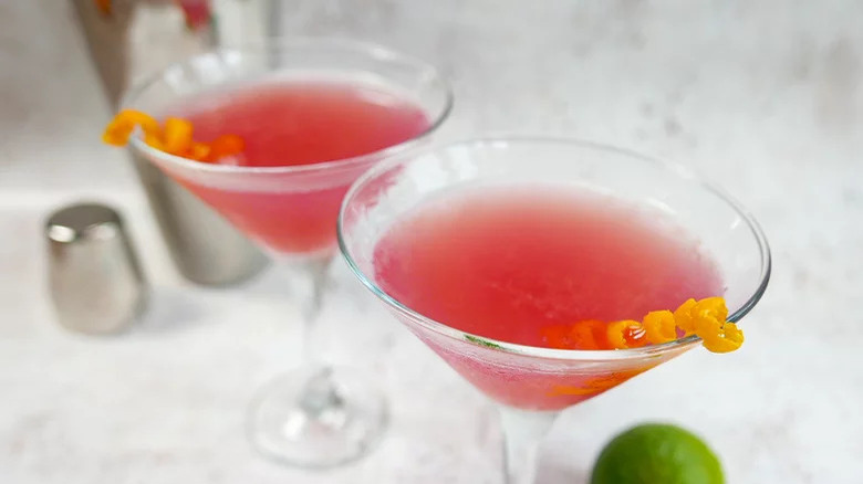 Two Cosmopolitan cocktails in Martini glasses