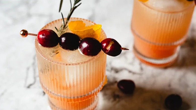 Close-up of a Cranberry Orange cocktail with garnishes