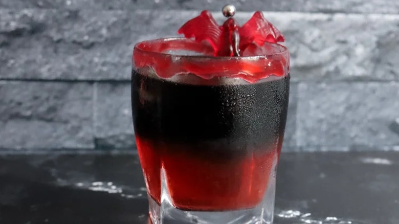 Vampire's Kiss Halloween cocktail with bat garnish