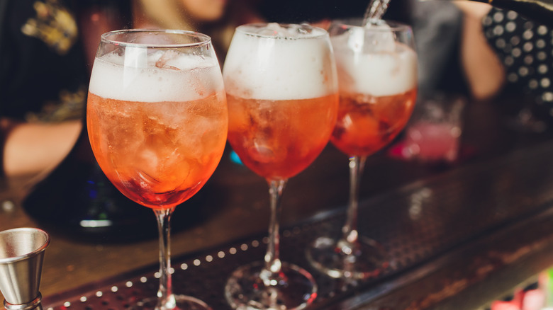 orange, bubbly drink in glass