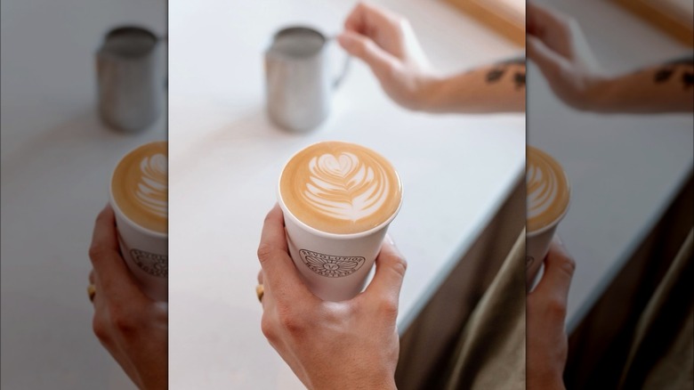 Hands grabbing coffee