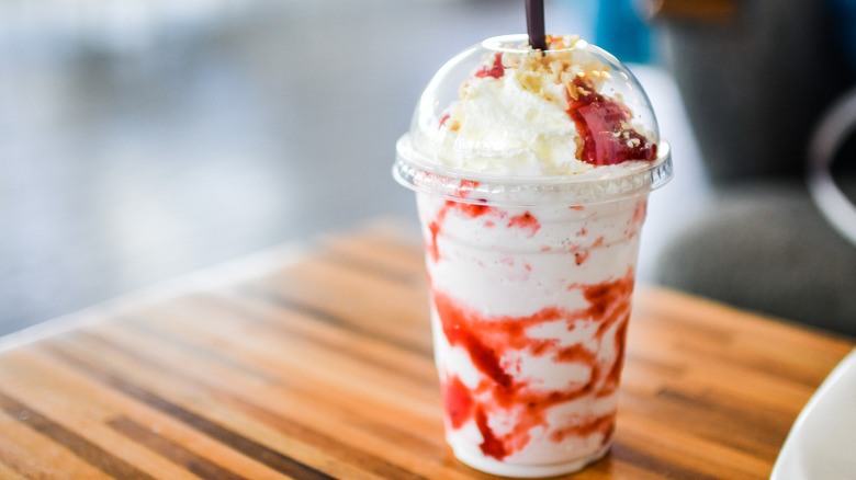 Strawberry cheesecake frappe on table