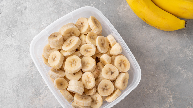 Frozen banana slices in container