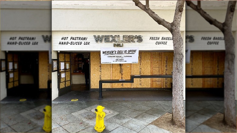 Wexlers sign tree white building yellow