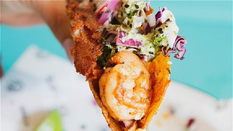 Shrimp taco with red onions