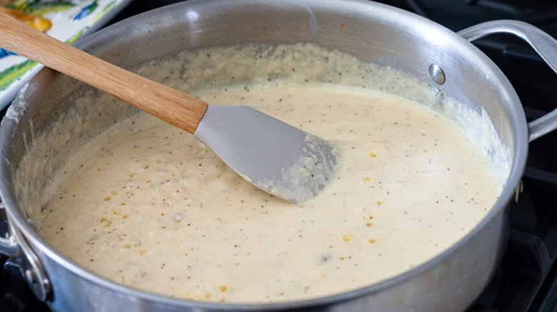 Alfredo sauce with a spatula