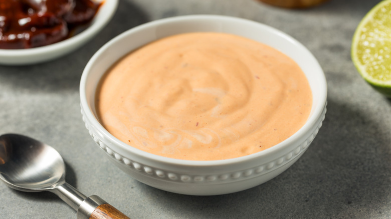 Homemade spicy mayo in a white bowl