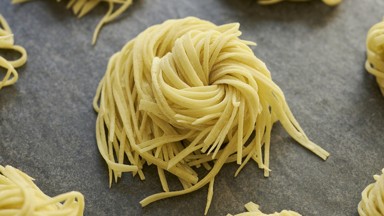 Balls of linguine on table