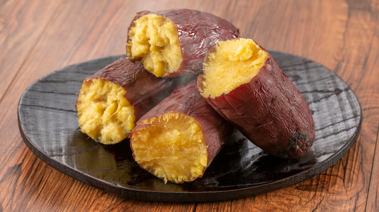 Baked potatoes on table