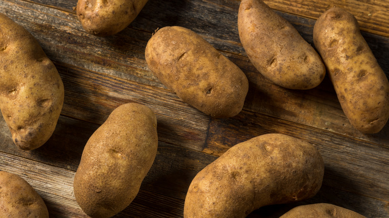 Russet potatoes on table