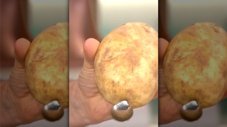 Teaspoon in potato