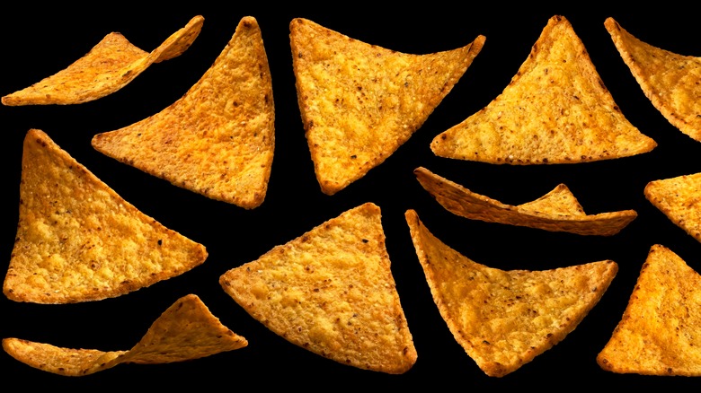 Tortilla chips on black background