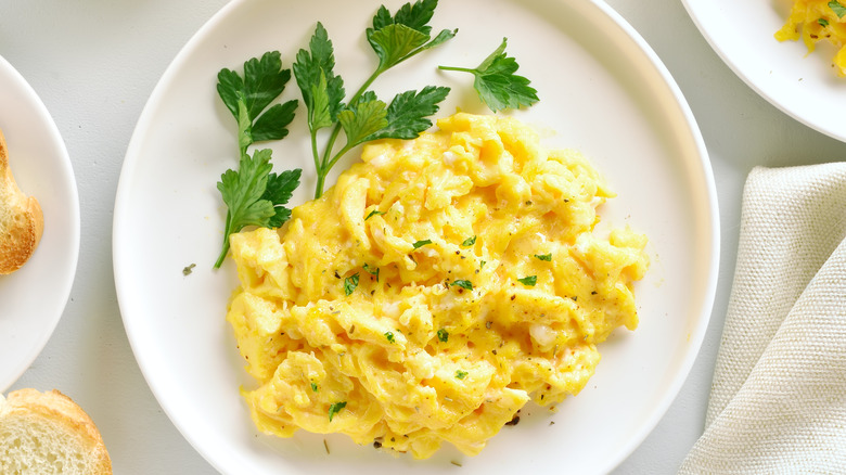 Scrambled eggs on white plate