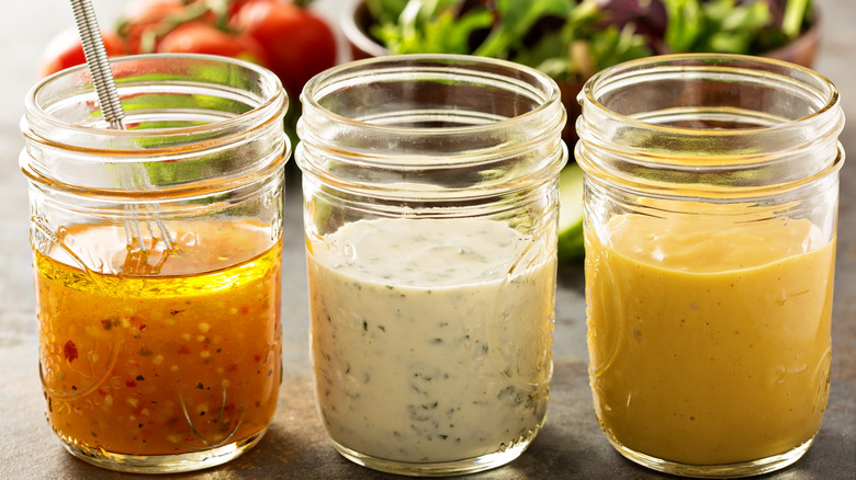 Three glass jars with liquid