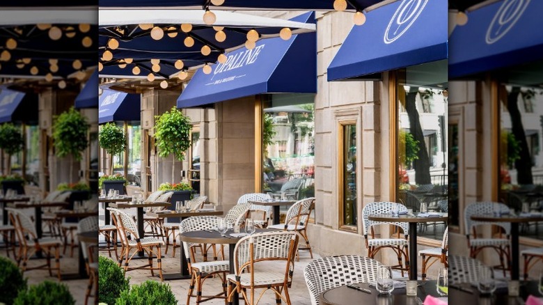 White chairs under blue awning