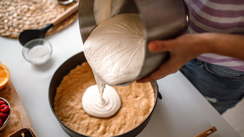 Person making cheesecake